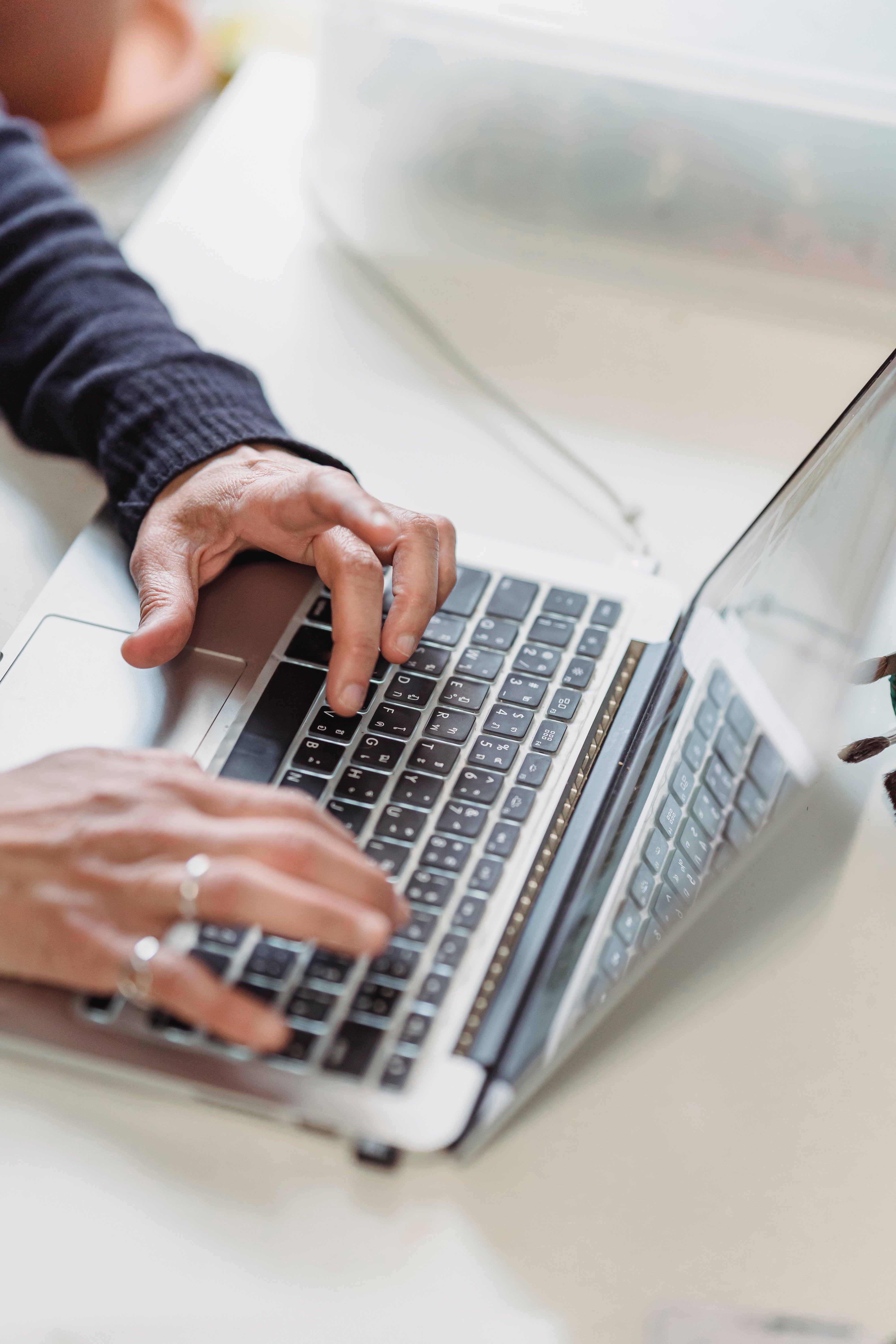 Person working on a laptop to build a small business website